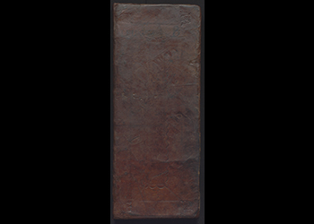 A digitized image of an 18th century ledger book with various scribblings on the cover.