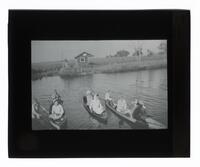 Lantern Slide #076: Men and women in canoes