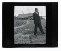 Lantern Slide #079: Man with tool