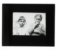 Lantern Slide #254: Montagnais-Naskapi boy, girl