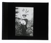 Lantern Slide #273: Montagnais-Naskapi boy with rabbit skin hat, Lake St. John