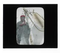 Lantern Slide #282: Montagnais-Naskapi man, dwelling