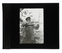 Lantern Slide #291: Montagnais-Naskapi boy with crossbow, Lake St. John, P.Q.