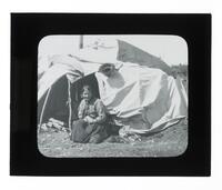 Lantern Slide #298: Montagnais-Naskapi woman outside dwelling