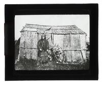 Lantern Slide #374: Tuscarora man outside dwelling