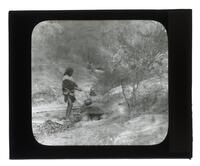 Lantern Slide #459: Native American man at campsite