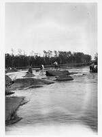 A048: En route on Berens Rivers, lining at rapids, Manitoba, circa 1930s