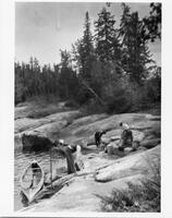 A047: En route on Berens River, stopping to unload at portage, Manitoba, circa 1930s