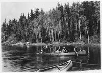 A075: En route on Berens River, Ojibwe men from Pauingassi arriving at Wolverine Rapids, Manitoba, 1938