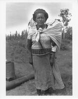 A030: Ojibwe woman carrying pack, Berens River, Manitoba, circa 1930-1933