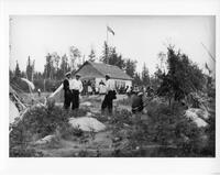 A333: Group of Ojibwe people gathering at trading post at Treaty time, Pikangikum, Ontario, 1940