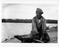 A064: Atoine Bittern with moose head, en route on Berens River, Manitoba, circa 1930s