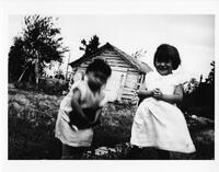 A026: Ojibwe boy and girl with kitten, Berens River, Manitoba, circa 1930-1933