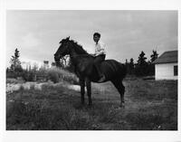 A027: John Berens riding a horse, Berens River, Manitoba, circa 1930-1933