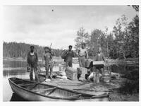 A045: Ojibwe group, en route on Berens River, at first portage above Little Grand Rapids, Manitoba, circa 1932-1933