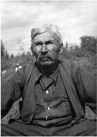 A008: Chief William Berens, seated outside, Berens River, Manitoba, circa 1930 or 1938