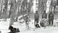 A043: Three Ojibwe men with dog train, Berens River, Manitoba, circa 1930-1933