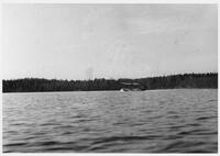 A085: Float plane landing on Family Lake, Little Grand Rapids, Manitoba, circa 1930s