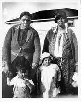 A033: Two Ojibwe women and two children, outside Hudson's Bay Company store, Berens River, Manitoba, circa 1930-1933