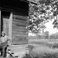 Chief Montour outside Cayuga longhouse