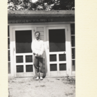 Vernon Bryson, standing out side of building.