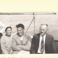 The Glasses and Dr. Whiting, on boat with water in background.