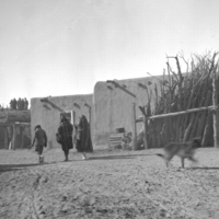 Two Tewa women, child, at Ohkay Owingeh