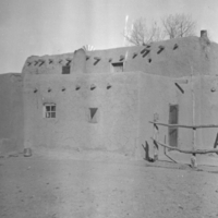 Adobe dwelling with ladder