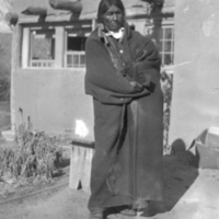 Tewa man, adobe dwelling