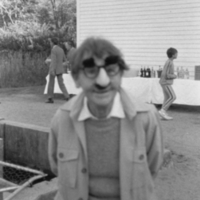 Barbara McClintock wearing Groucho Marx glasses.