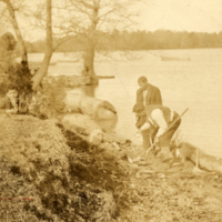 8-1-n: Two Pamunkey men digging clay along the bank of the river for pot making.