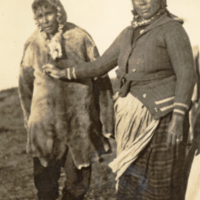 6-12-c: Man and woman, standing outside, Natashquan, Canada.