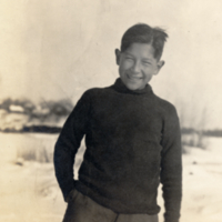 9-18-d: Portrait of boy, standing outside.