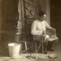 9-11-g: Man making snow shoes.