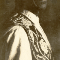 9-12-k: Peter Nelson wearing ceremonial collar and cuffs.