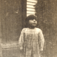 9-7-c: Penobscot girl, standing outside.