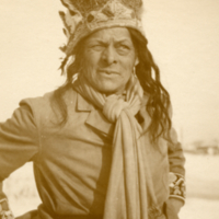 9-8-c: Charlie "Daylight" Mitchell with feather headdress.