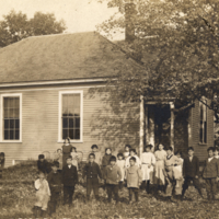 9-2-b: Group outside Indian Island School, Oldtown, Maine, postal card.