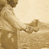 9-2-g: Penobscot dance leader, Peter Nelson, with rattle.