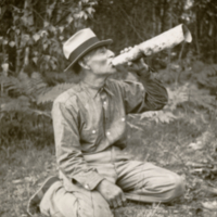 9-2-k: Francis Xavier Tomah using birch bark moose call.