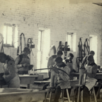 Indian boys at work in saddler shop at Indian Training School