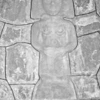 Mayan stone figure, wall