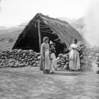 Tepecano children near stone wall