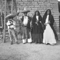 Tepecano family, holding objects