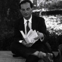 Stanislaw M. Ulam sitting outside with book.