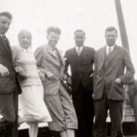 W. F. G. Swann and others leaning on ship railing.