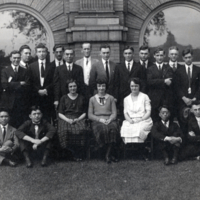 Group portrait, outside, Swann standing, back row.