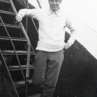 W. F. G. Swann, standing on steps on ship.