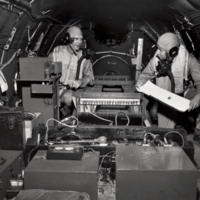 Two unidentifed men in flight suits.