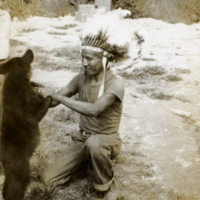 Cherokee man with bear cub